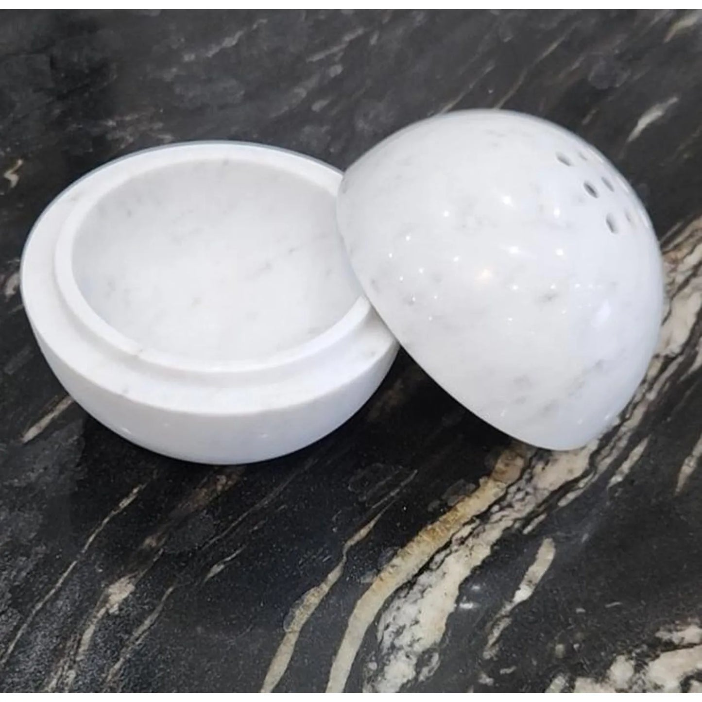Carrara white marble sphere incense burner with natural veining opened to see top piece and bottom piece