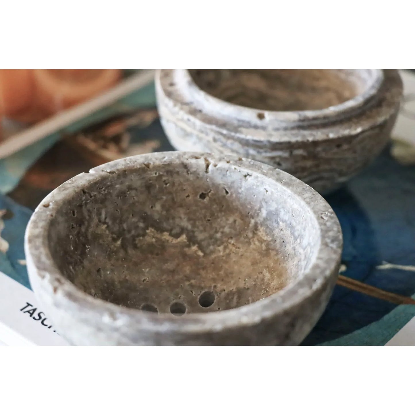 Grey travertine sphere incense burner handcrafted from natural stone, modern minimalist incense holder for home decor and aromatherapy close up to see detail