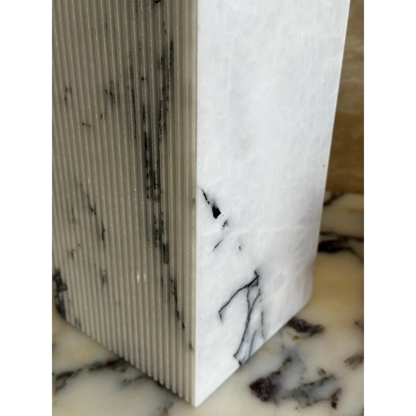 Lilac marble vase with ribbed texture modern decor close up