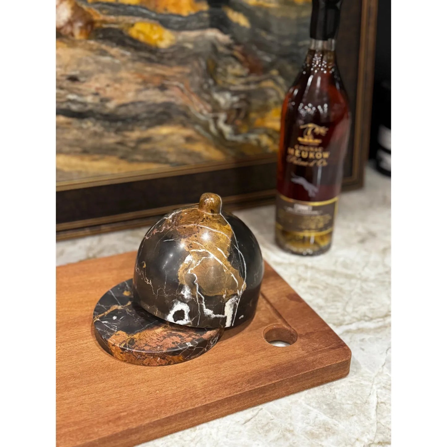 Marble butter dish with lid on chopping board