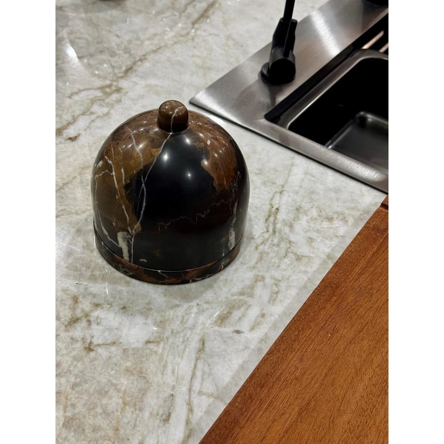 Marble butter dish with lid on kitchen counter closed