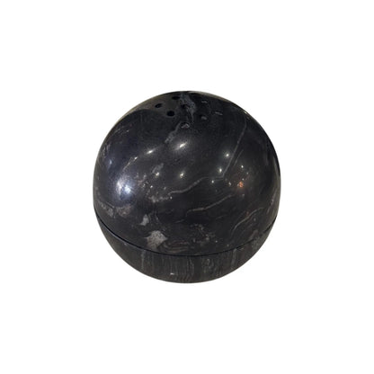 Titanium black marble sphere incense burner with natural stone texture on white background
