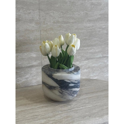Viola Calacatta marble vase with purple veining with flower inside