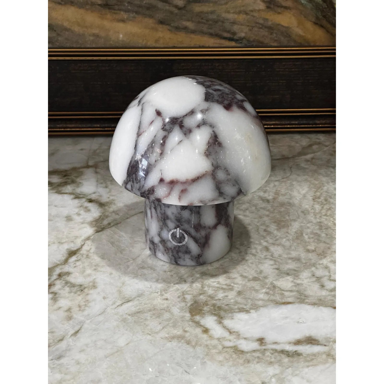 calacatta viola marble mushroom lamp with purple veining on desk