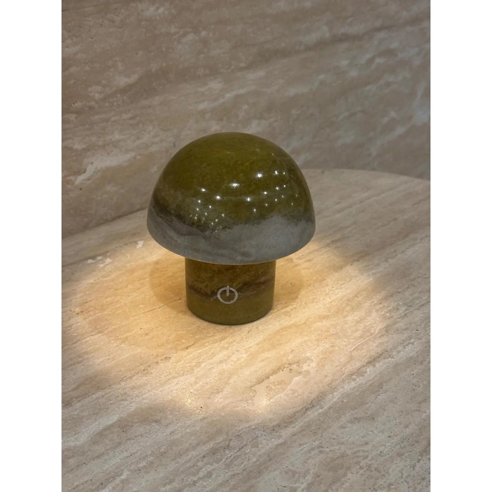 green marble mushroom lamp glowing on desk